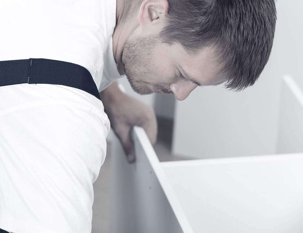 An ITLM-Group worker performs furniture assembly